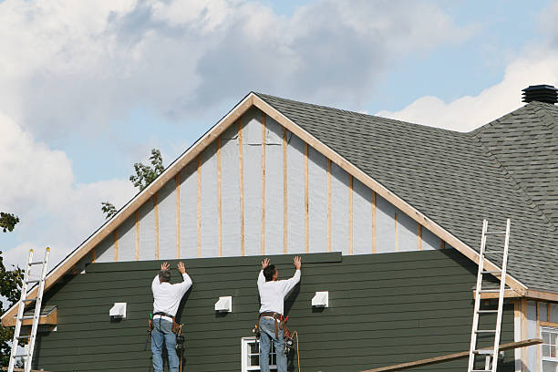 Professional Storm Damage Siding Repair technician working in Slovan, PA